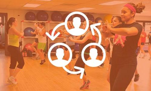 a Zumba class in the Carroll YMCA with a circular icon of people on top